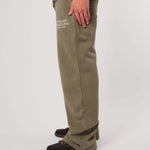 Natural Art Studio vintage wash green sweatpants with faded logo and elastic waistband