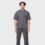 Annie Hood College T-shirt in washed black with relaxed fit, made from 280gsm cotton, worn by a 6'0 model in size M