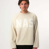 Natural Art Studio Sand Applique L/S cotton tee with distressed front logo and screen print back, boxy fit.