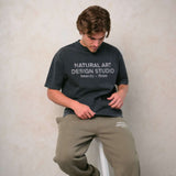 Natural Art Studio faded print washed charcoal cotton t-shirt with screen print front and back logo, boxy fit, and oversized drop shoulder