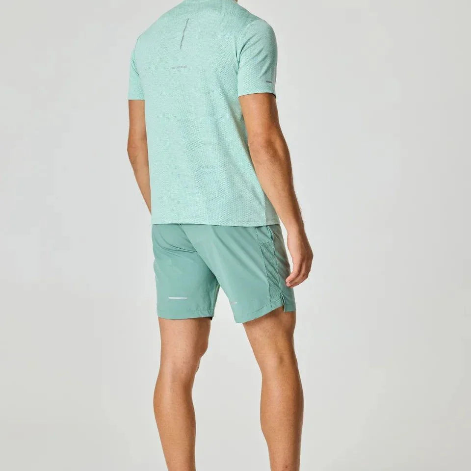 Reprimo Pulse T-Shirt in Seafoam color worn by a standing person.