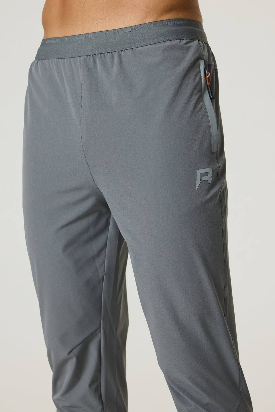 Reprimo Summit Pant in slate and light grey with lockable zip puller and custom jacquard waistband, athletic performance pants.