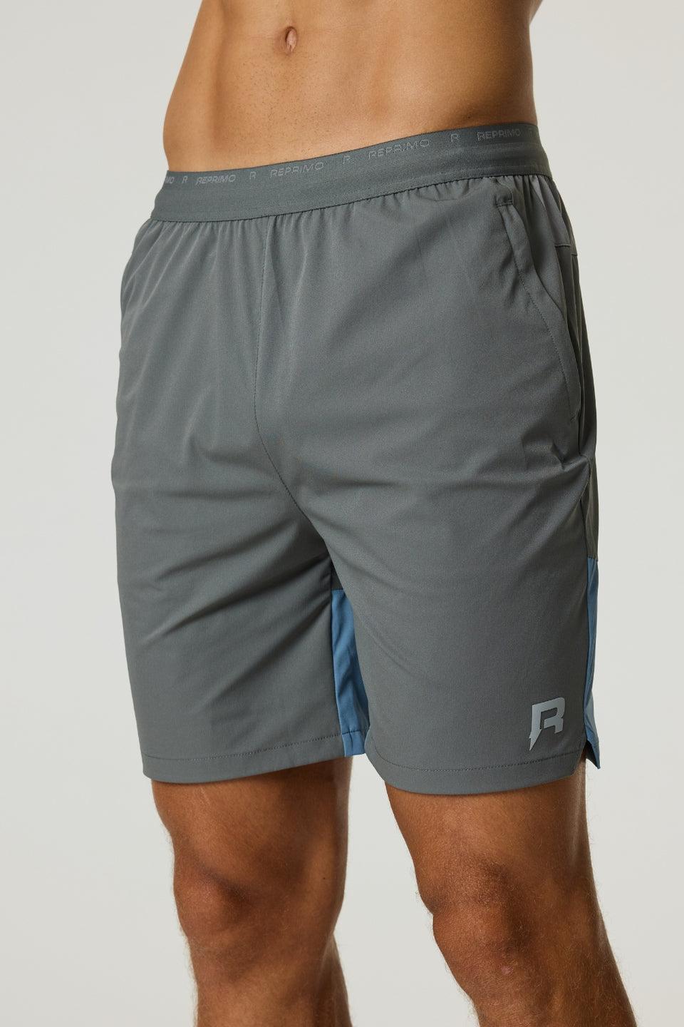 Reprimo Flight Shorts in Air Force Blue and Gunmetal, lightweight breathable athletic shorts with elastic waistband and zippered side pockets.