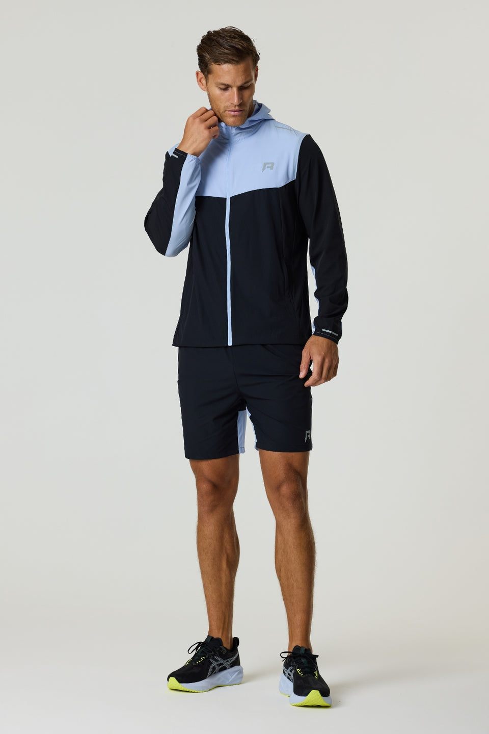 Reprimo Flight Windbreaker in black and dusky sky with zip pockets and breathable back vent, lightweight polyamide jacket for wind and light rain protection