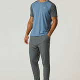 Man wearing Reprimo Flight Pants and matching athletic shirt in Air Force Blue and Gunmetal colors