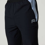 Black Reprimo Flight Pants with dusky sky side panels, elastic waistband, functional zippered pockets, and reflective strips for visibility.