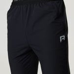 Black Reprimo Flight Pants with branded waistband and reflective logo for athletic performance and comfort