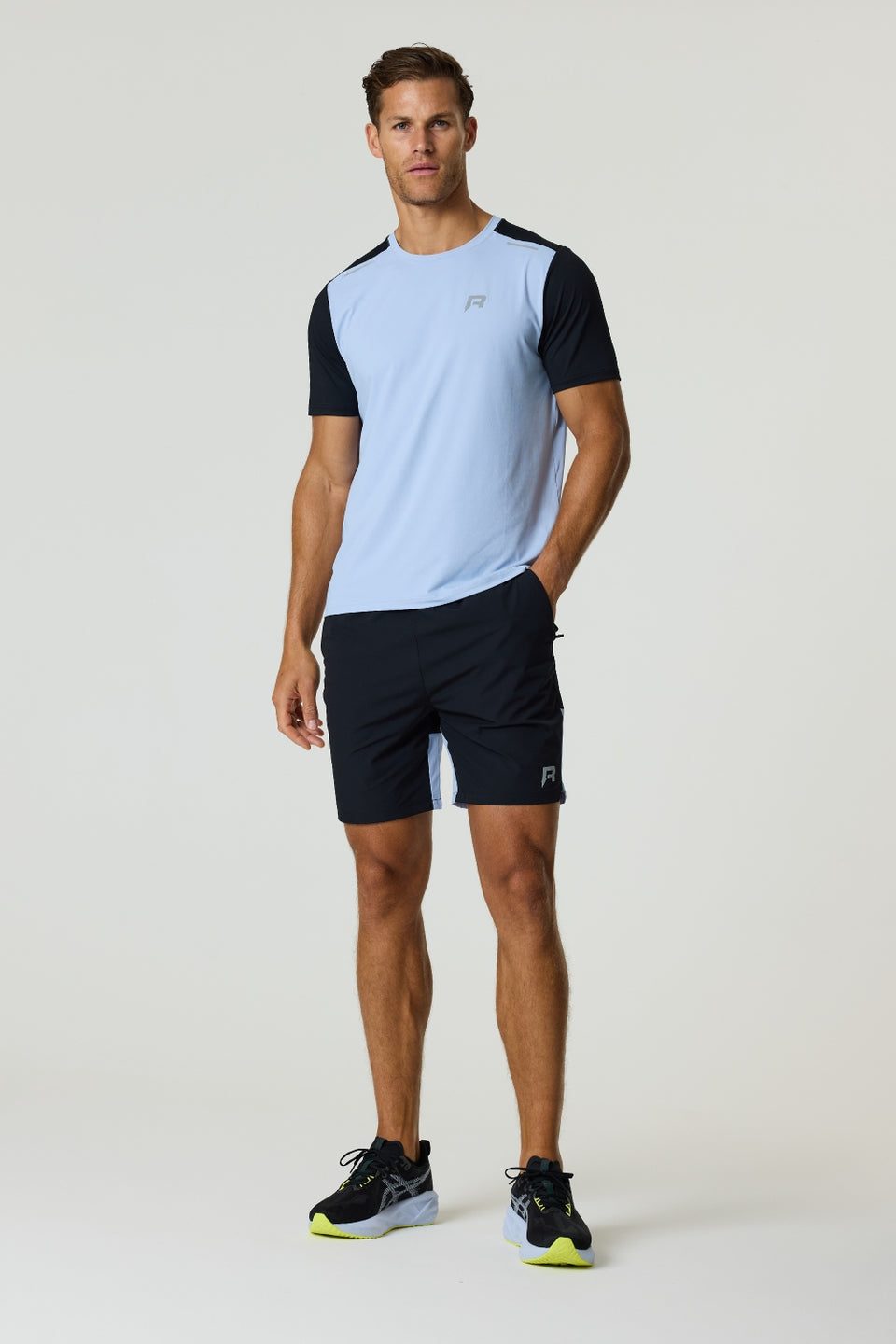 Reprimo Flight T-Shirt in black and dusky sky with lightweight, breathable fabric and reflective strips for enhanced visibility during athletic activities.
