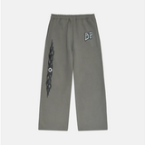 Broken Planet Gunmetal Grey wide-leg sweatpants with graphic design.