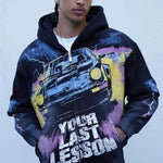 Last Lesson Black Car Hoodie with graphic vintage car design and bold text on front worn by male model