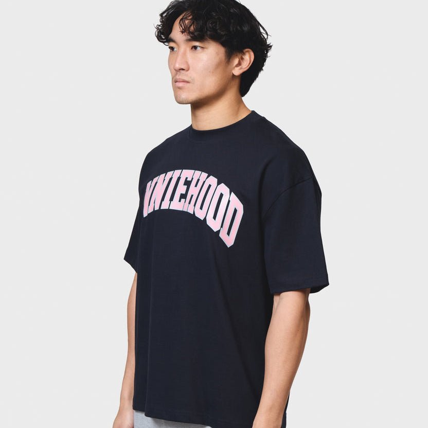 Navy ANNIE HOOD COLLEGE arch logo cotton t-shirt with relaxed fit worn by 6'0" model