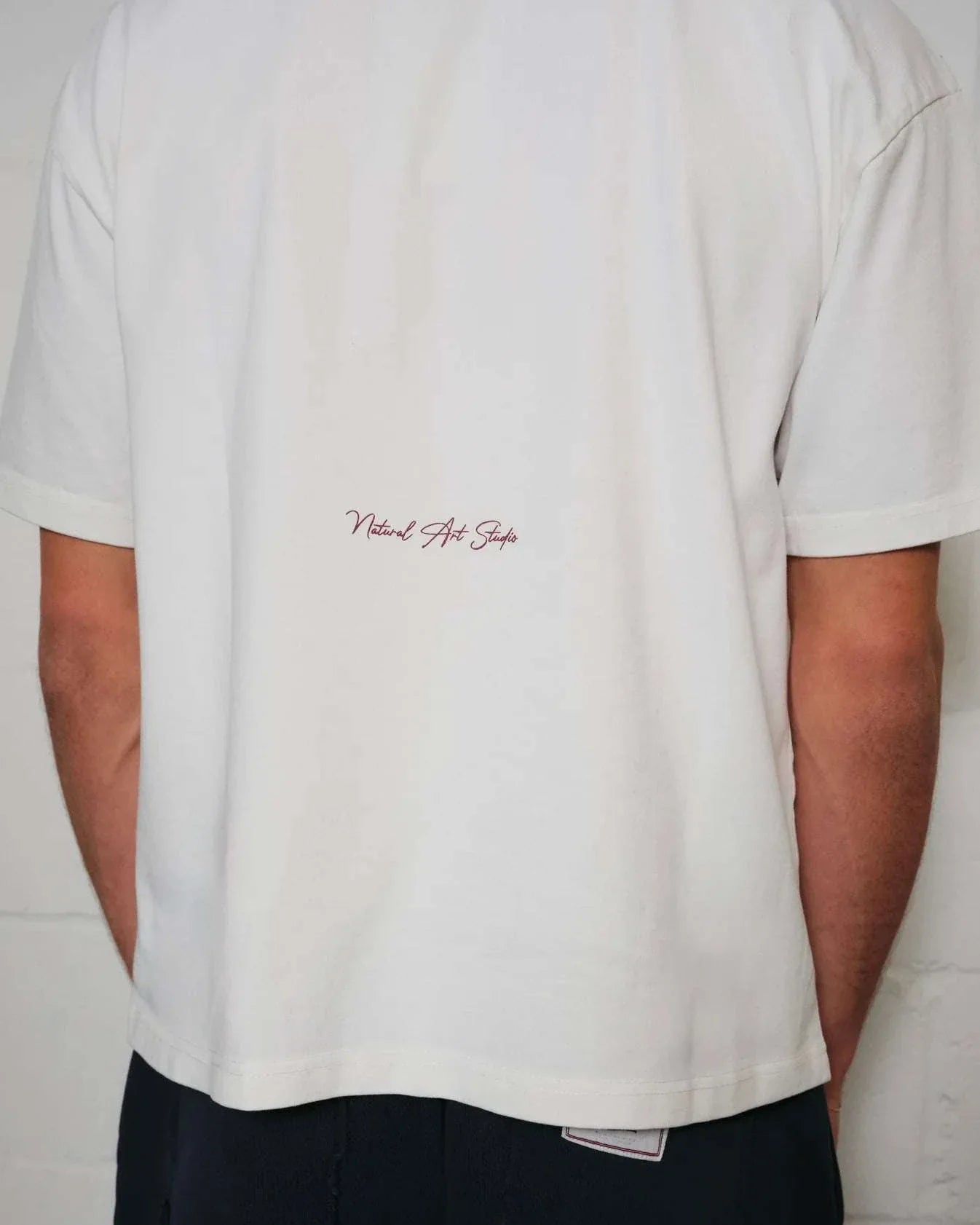 Natural Art Studio white cotton boxy fit tee with red back logo print.
