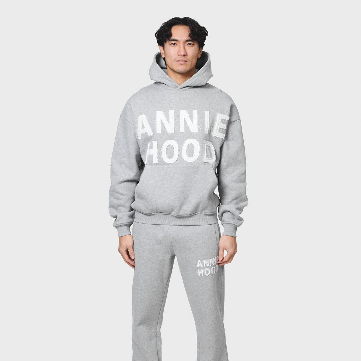 Grey ANNIE HOOD APPLIQUE HOODY made from 500gsm brushback cotton with relaxed fit on a tall model