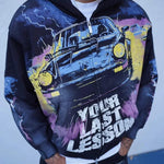 Last Lesson Black Car Hoodie with graphic car design and bold text worn by model