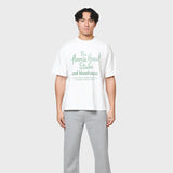 Annie Hood Factory T-shirt in white, 280gsm cotton, relaxed fit worn by 6'0" model in size M