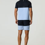 Rear view of a man wearing a black and dusky sky Reprimo Flight T-Shirt with athletic fit and reflective strip, paired with matching shorts