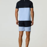 Rear view of a man wearing a black and dusky sky Reprimo Flight T-Shirt with athletic fit and reflective strip, paired with matching shorts