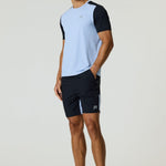 Athletic man wearing black Reprimo Flight Shorts with side zip pockets and light blue and black performance t-shirt