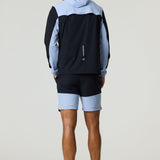 Man wearing black and dusky sky Reprimo Flight Windbreaker with hood and zip pockets, paired with matching shorts