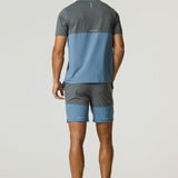 Man wearing Reprimo Flight T-Shirt in Air Force Blue and Gunmetal with matching shorts, showing back view.