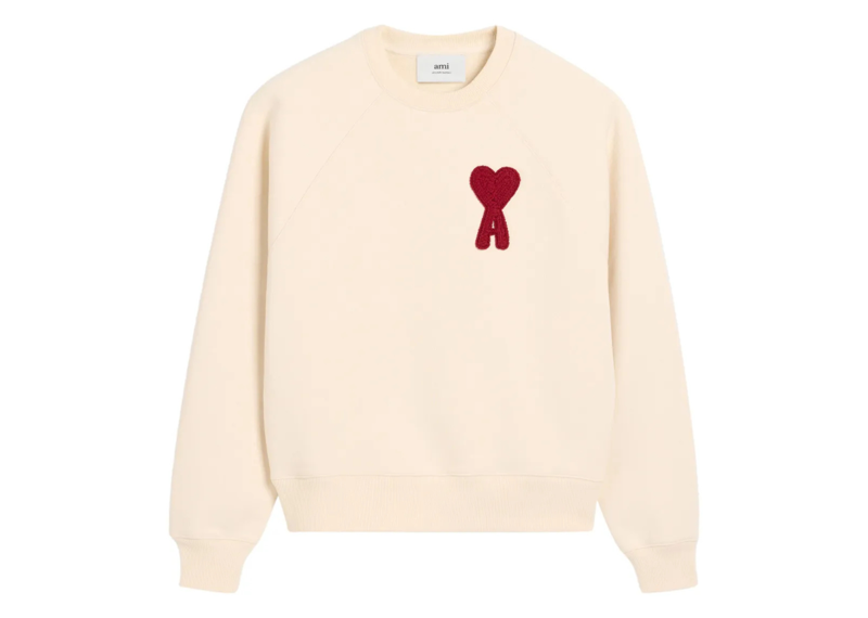 Cream AMI Paris sweatshirt with red Ami De Coeur patch on chest