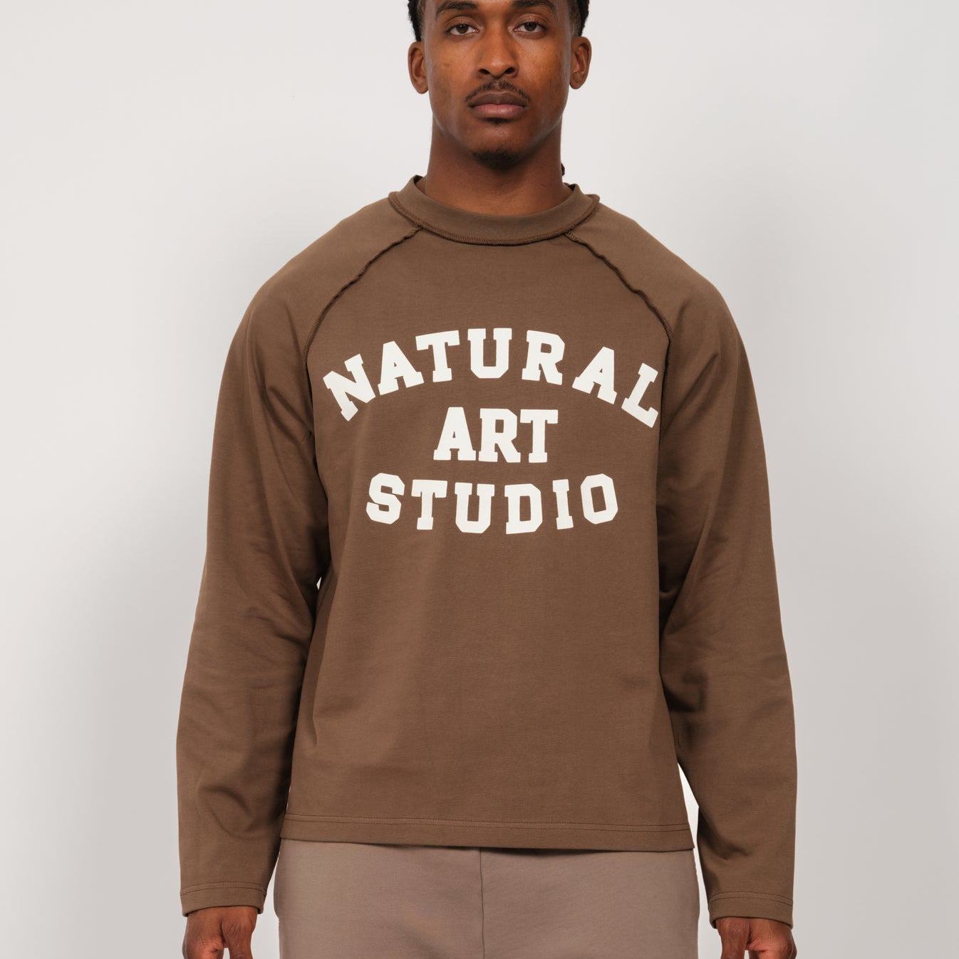 Natural Art Studio Raglan L/S cotton shirt with inside-out raglan seams and front-back screen print logo