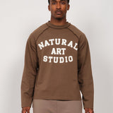 Natural Art Studio Raglan L/S cotton shirt with inside-out raglan seams and front-back screen print logo