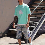 Last Lesson Graffiti 3 Layer T-Shirt in vibrant urban setting.