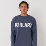 Natural Art Studio navy long sleeve cotton top with distressed appliqué logo and boxy fit
