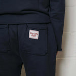 Natural Art Studio navy cotton applique sweatpants with elastic waistband and raw edges