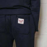 Natural Art Studio navy cotton applique sweatpants with elastic waistband and raw edges