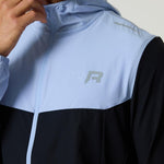Reprimo Flight Windbreaker in black and dusky sky with lightweight, wind-resistant design and zip pockets for outdoor activities