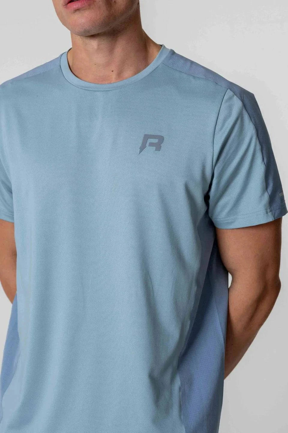 Reprimo Nova T-Shirt in Aqua/Dusk Blue worn by a model.