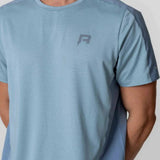 Reprimo Nova T-Shirt in Aqua/Dusk Blue worn by a model.