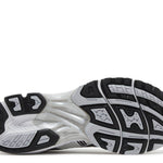 Gel Kayano 14 running shoe sole in white and black with Tai-Chi yellow accents