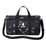 Bape Duffle Bag in black camo design with shoulder strap.