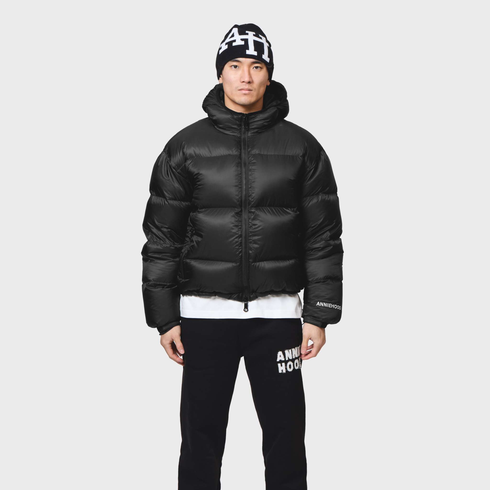 Annie Hood Hood Puffer jacket with 100% nylon outer, down filling, and rain resistance worn by 6'0 model in size M