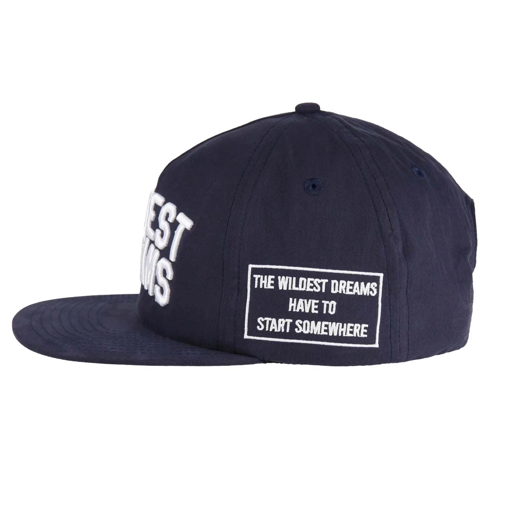 Wildest Dreams Varsity Cap navy with white embroidered text and patch