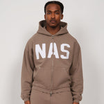 Taupe Natural Art Studio hoodie with appliqué logo, raw cuff seams, metal rivet pockets, luxury athletic fit, and dropped shoulders