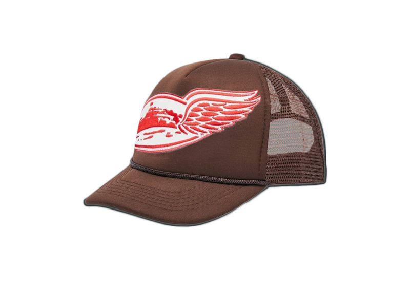 Corteiz Alcatraz Wing Trucker Hat in brown with mesh back and wing design.