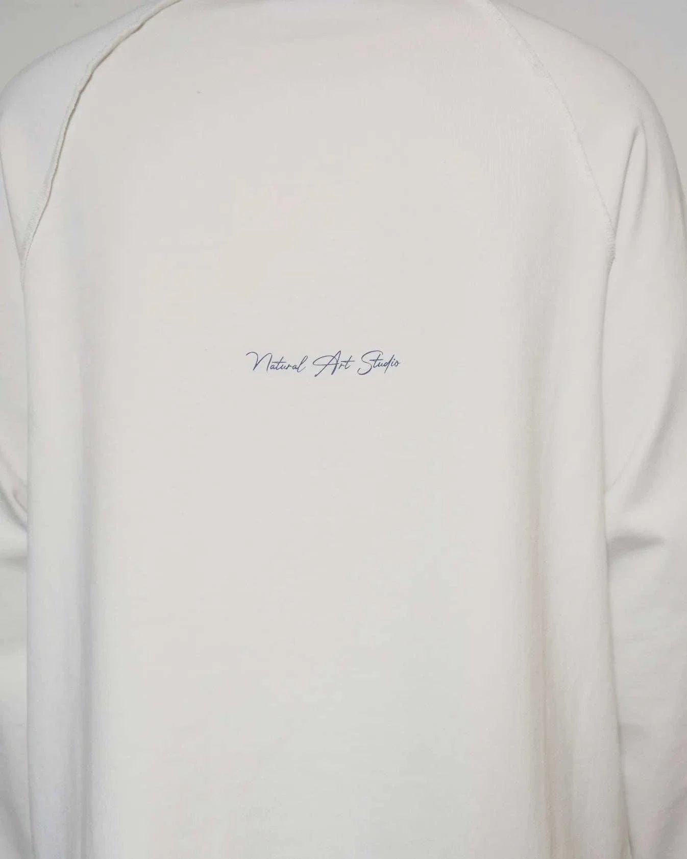 Natural Art Studio white cotton long sleeve shirt with distressed appliqué and screen print logo