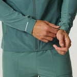 Men's Reprimo Glide Jacket in botanical pine green with front zipper and adjustable cuffs