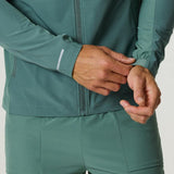 Men's Reprimo Glide Jacket in botanical pine green with front zipper and adjustable cuffs