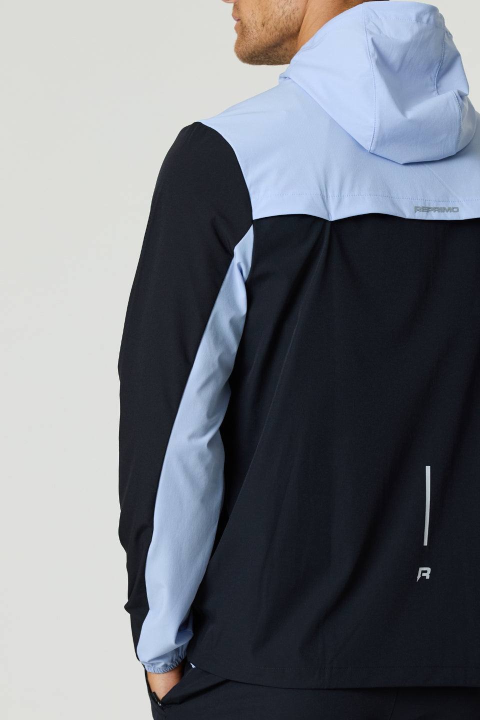 Reprimo Flight Windbreaker black and dusky sky lightweight weather-resistant jacket with hood and zip pockets