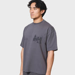 Washed black ANNIE HOOD COLLEGE T-SHIRT in relaxed fit made from 280gsm cotton, modeled by 6'0" person wearing size M