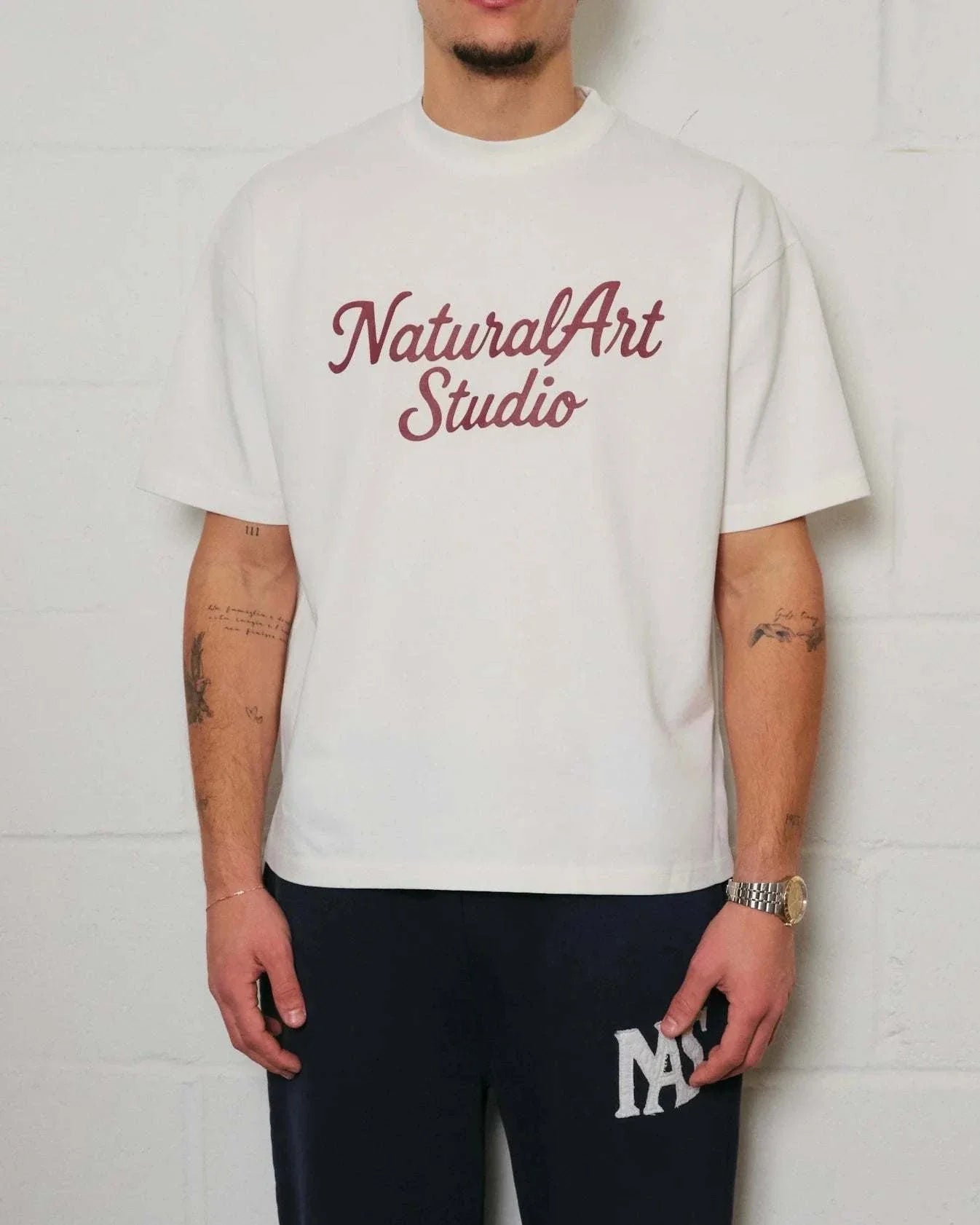 White Natural Art Studio boxy fit tee with red logo print on front and back