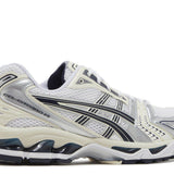 White and midnight Wmns Gel Kayano 14 running shoe with black stripes and cushioned sole