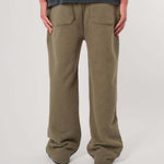 Natural Art Studio vintage wash green sweatpants with faded logo and elastic waistband