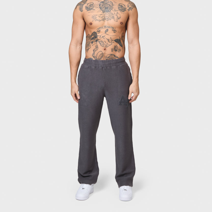 Annie Hood College Joggers in washed black with 500gsm brushback cotton and relaxed fit worn by a 6'0 model with 31 waist
