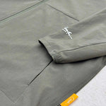Close-up of Studio By Charles khaki lightweight track jacket sleeve and pocket detail